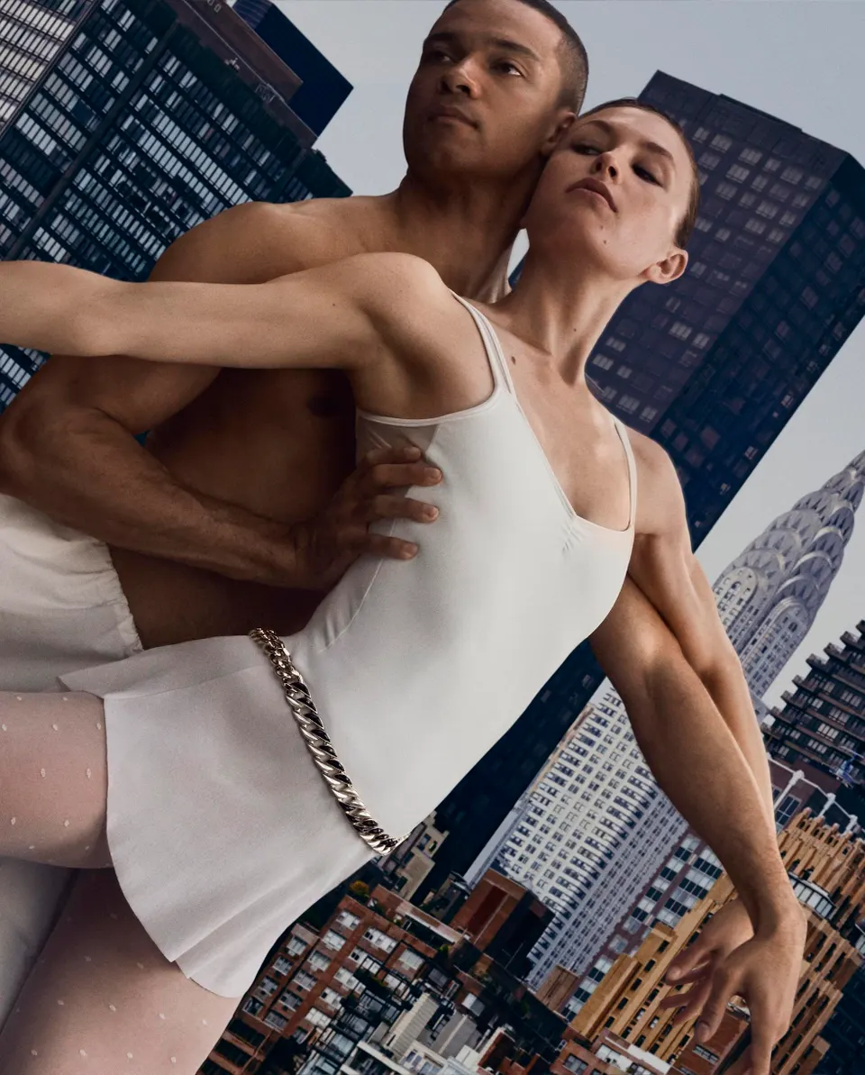 Two dancers in a duet above the city