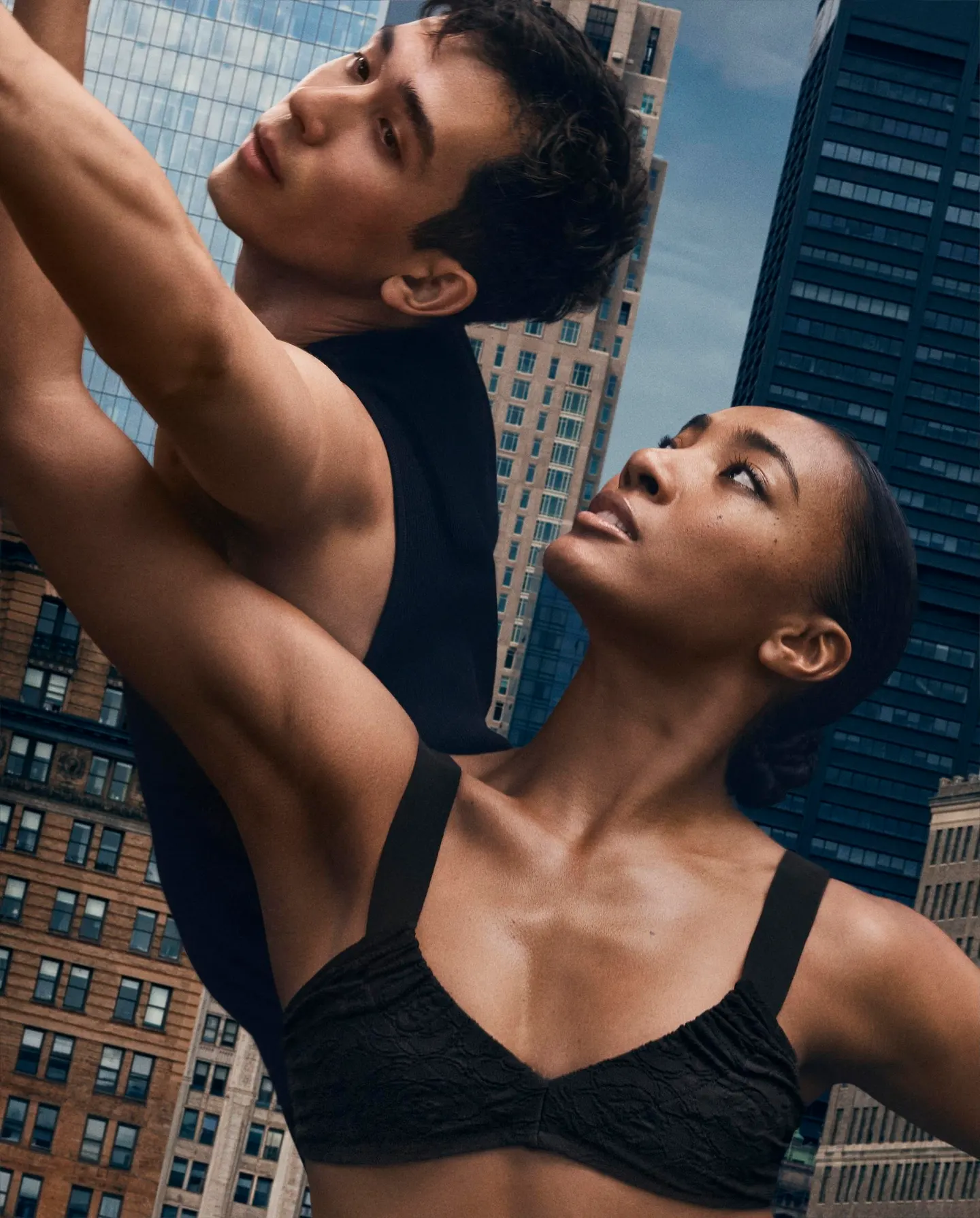 Two dancers looking upward