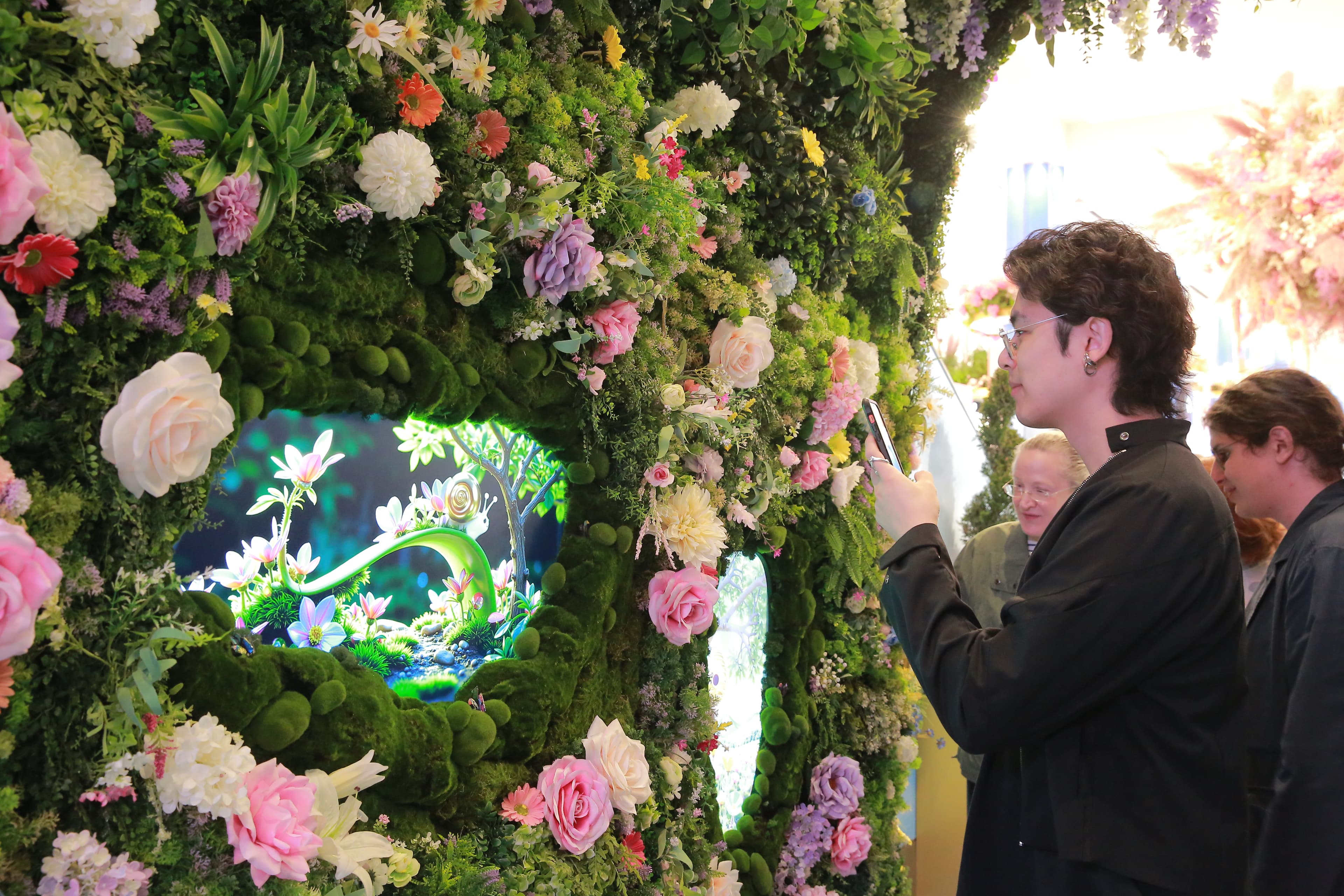 Visitors at the Flower Show arch