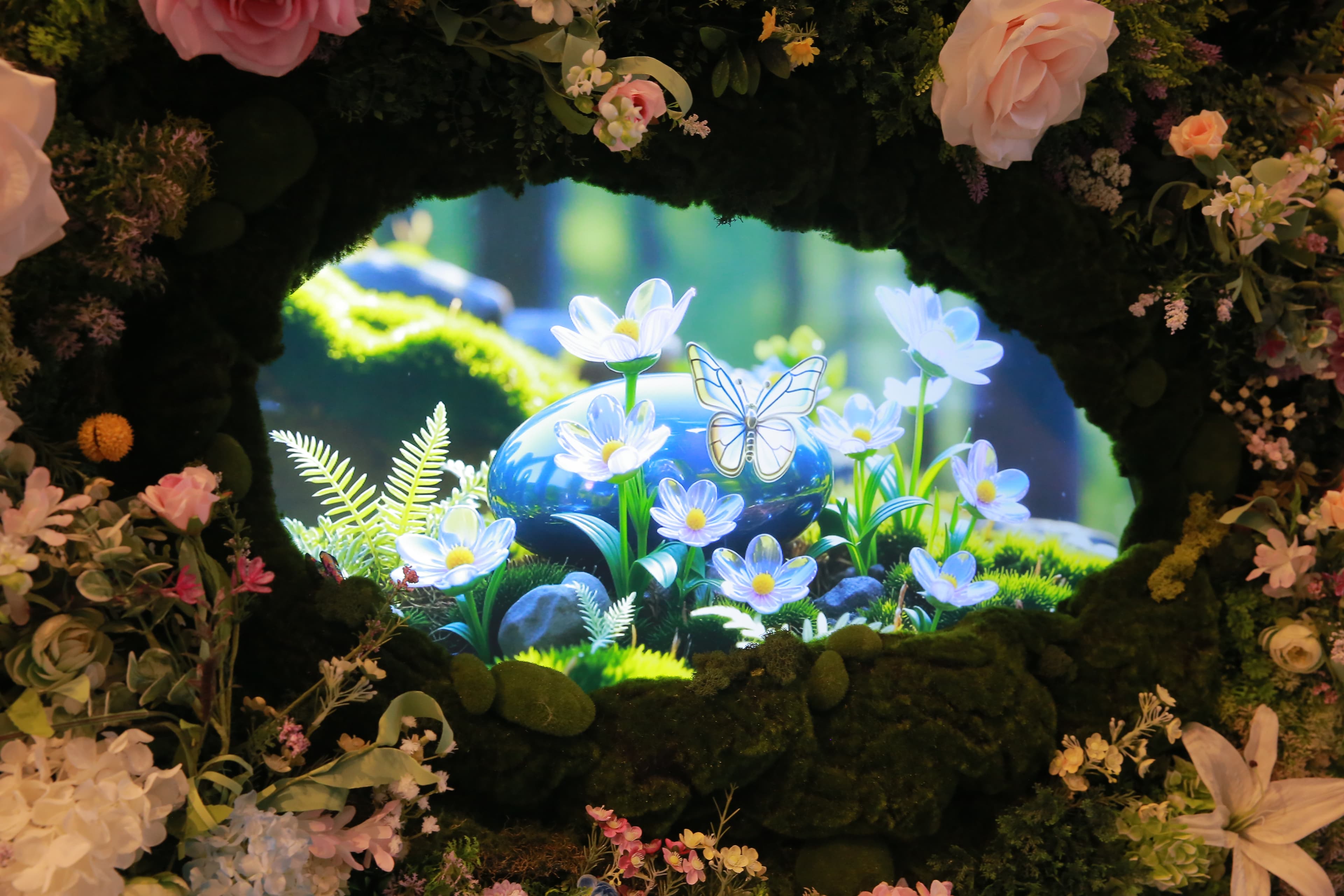 The floral portal lit at night